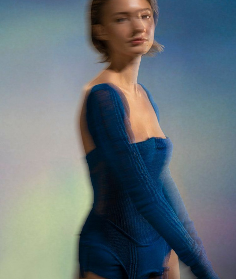Blurry editorial of girl modelling blue bodysuit made by Filippa Fuxe